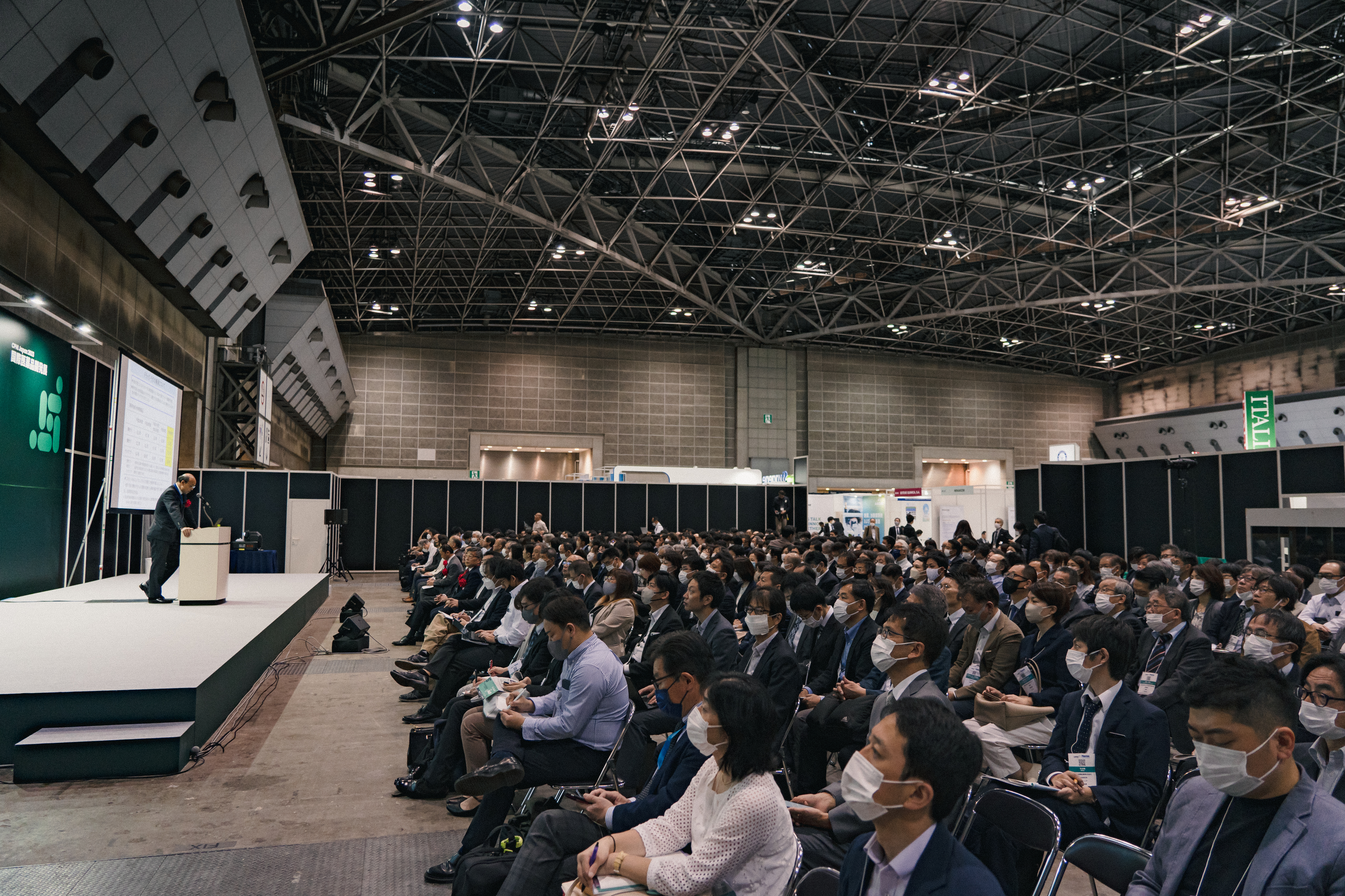 CPHI Japan - Pharma members in hall listening to speaker on stage