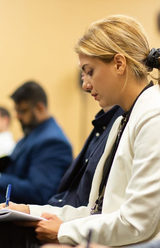 Woman taking notes at CPHI event