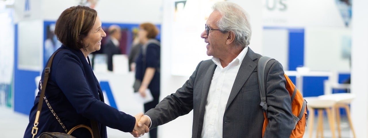Pharma professional shaking hands