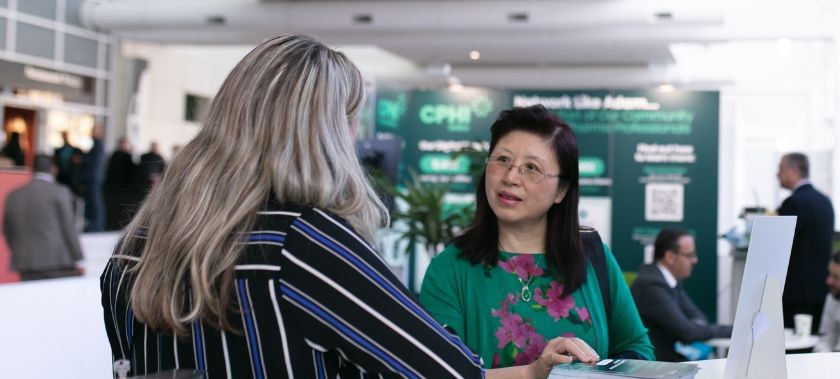 two female pharma professionals having a conversation at CPHI event