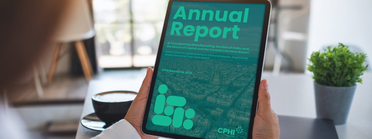 Person holding computer tablet displaying Pharma annual report