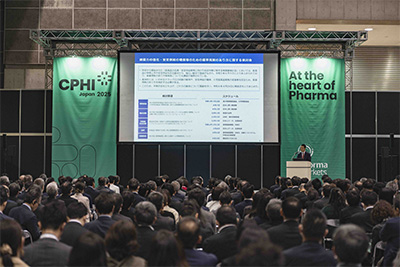 Group of pharma professionals cutting the ribbon at CPHI Japan event